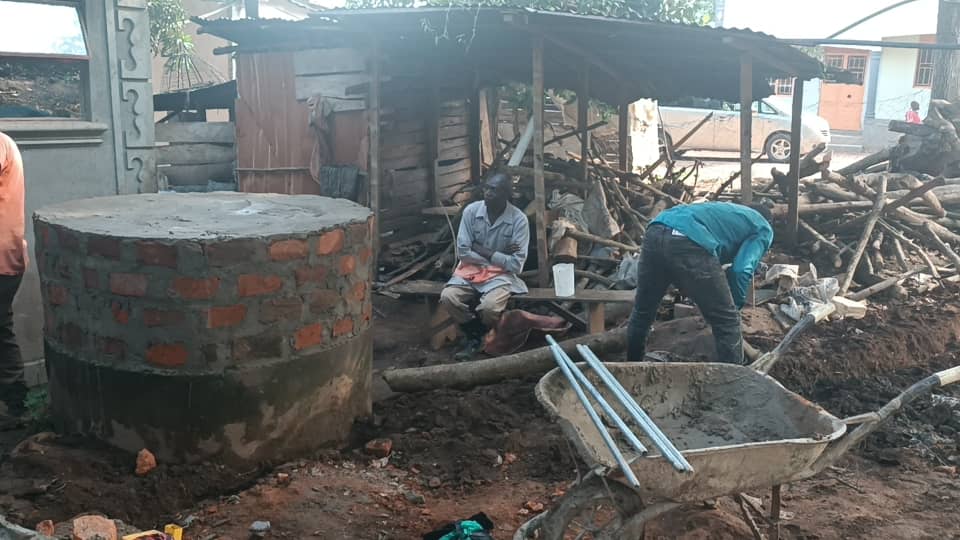 brick well under construction at a village water site