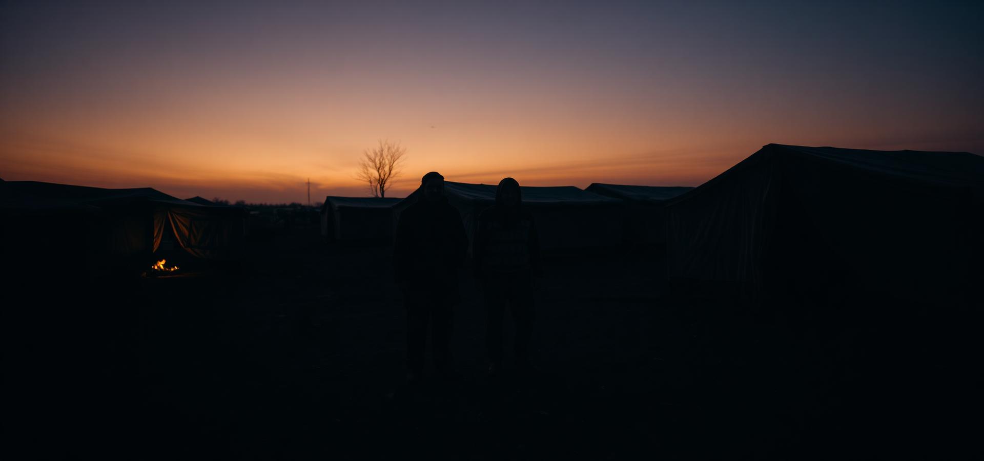 displaced families at a tent settlement